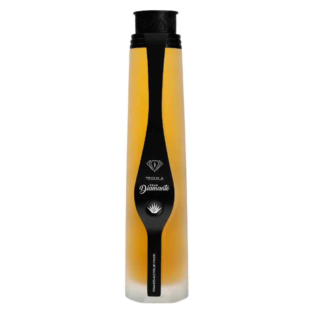 “Gran Diamante Añejo Tequila bottle with diamond-shaped design and amber tequila inside”
