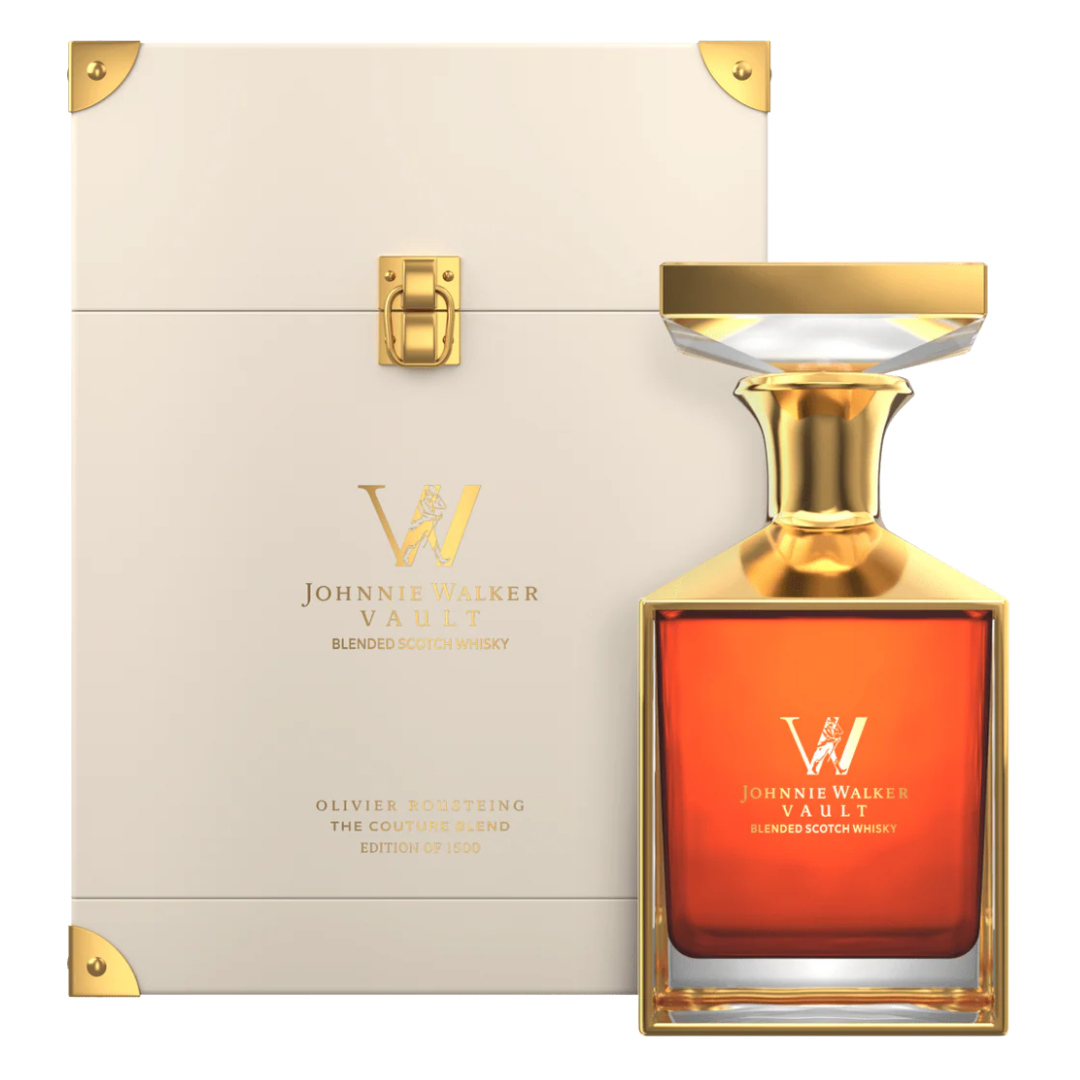 Johnnie Walker Vault whisky bottle with gold cap and box on a white background